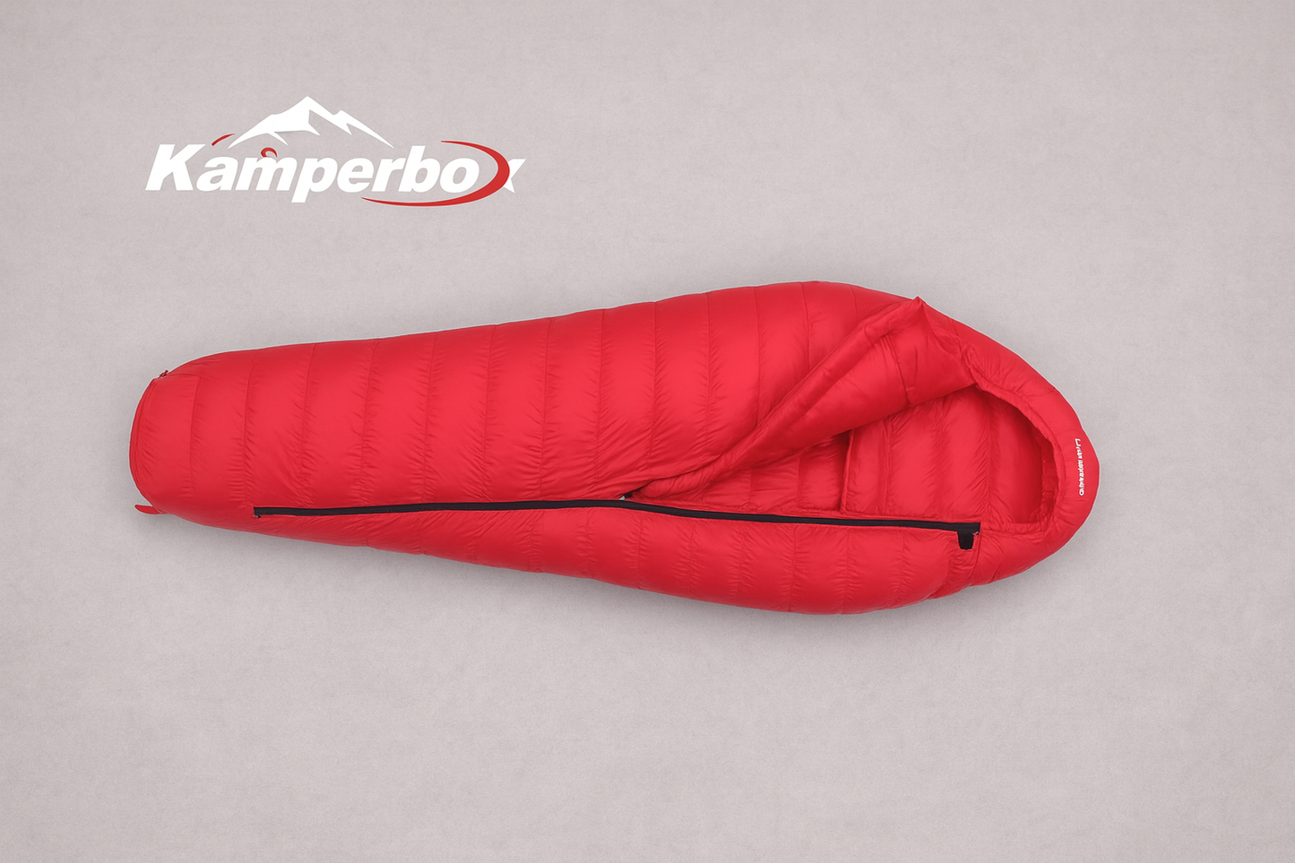 Red sleeping bag with Kamperbo logo on a gray background