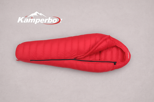 Red sleeping bag with Kamperbo logo on a gray background