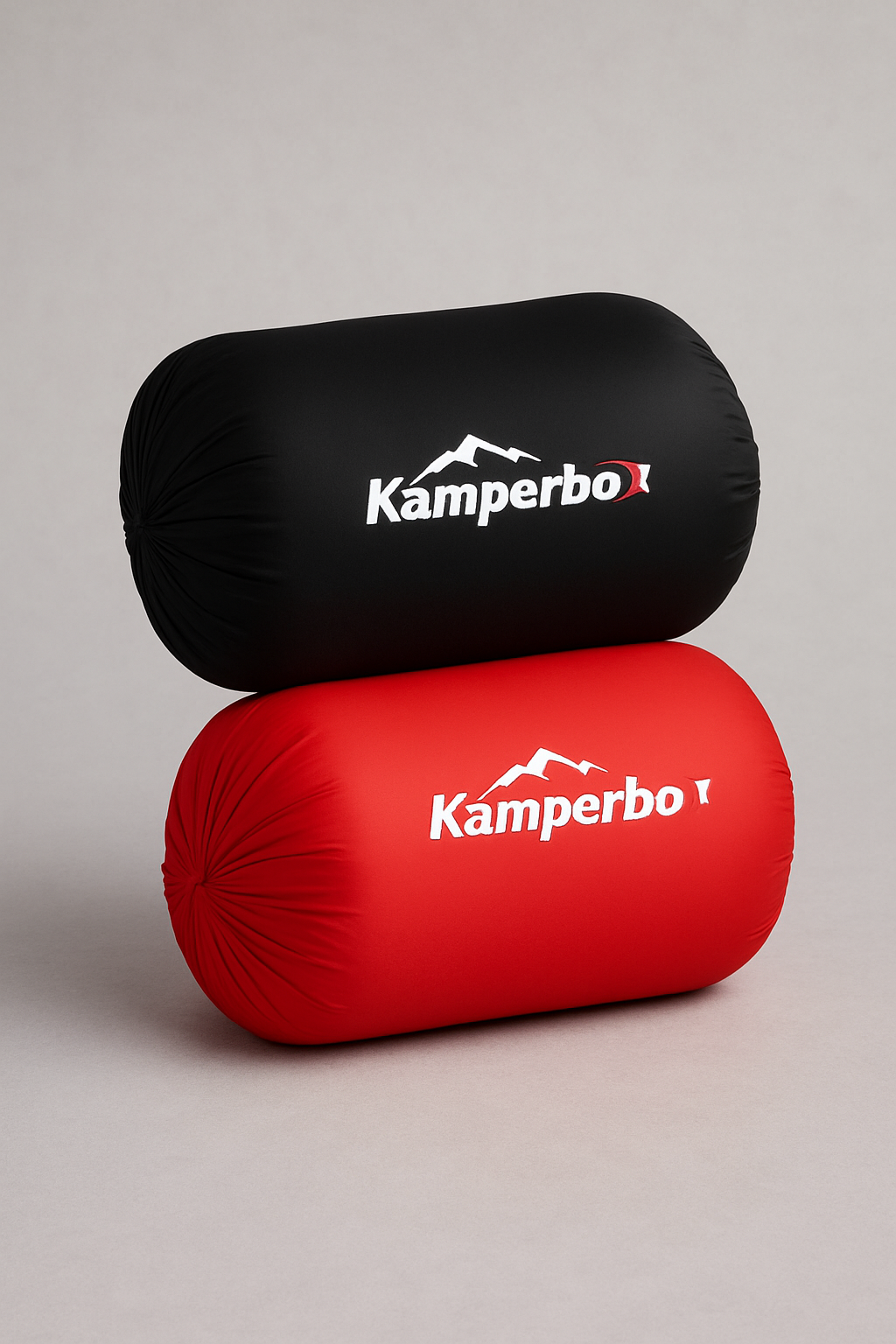 Two Kamperbo branded pillows, one black and one red, on a gray background.