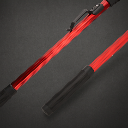 Red and black object on a dark gray background