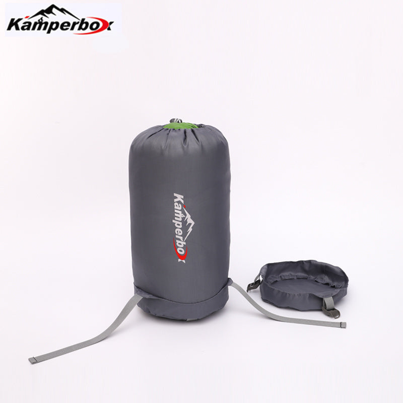 Gray compression sack with Kamperbox logo on a white background